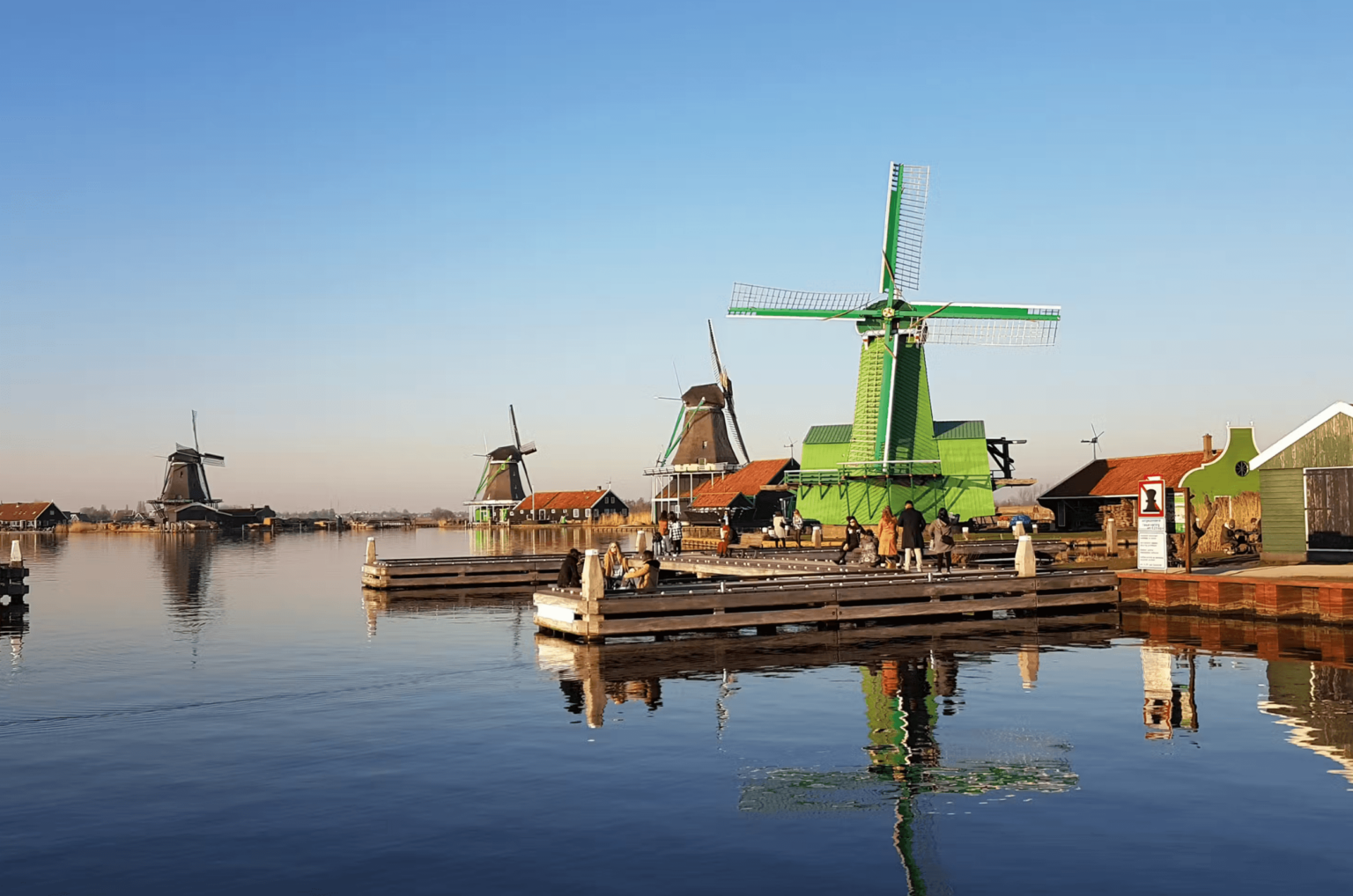 Cruise boat passing the windmills of the Zaanse Schans